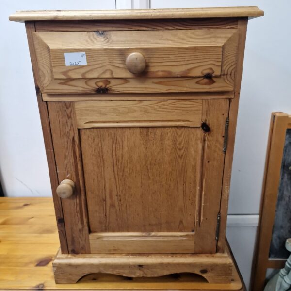 Vintage pine bedside cabinet with single drawer and panelled door.
