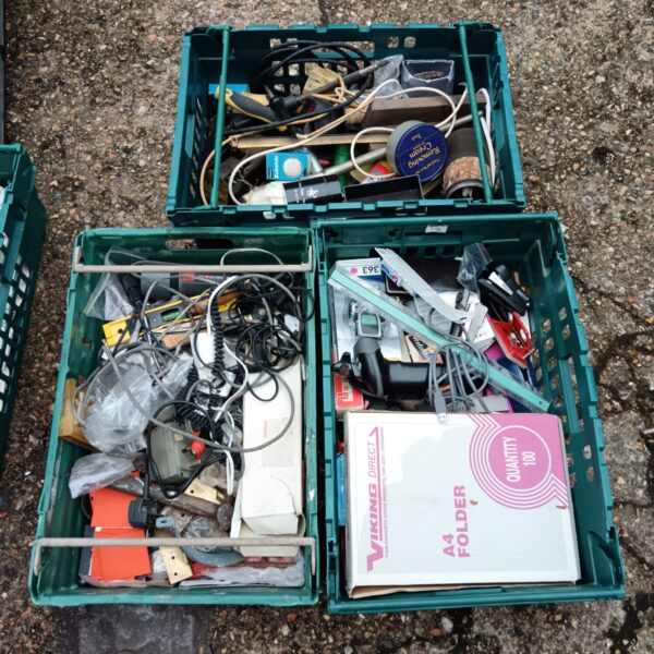 Tray of mixed tools and hardware for DIY projects.