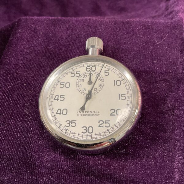 Vintage Ingersoll stopwatch with black dial and white numerals.