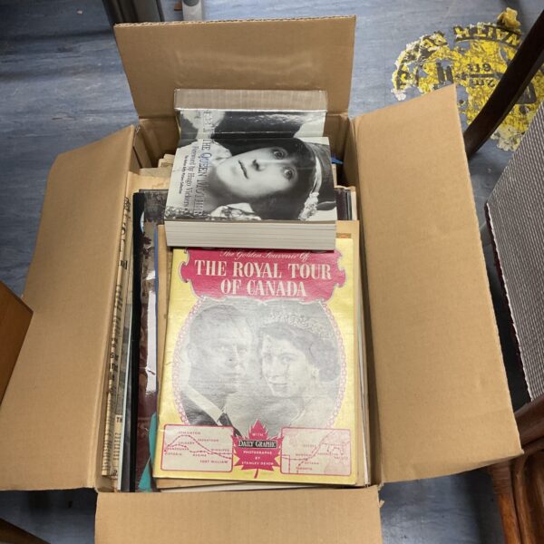 Box of vintage royal family memorabilia and books.