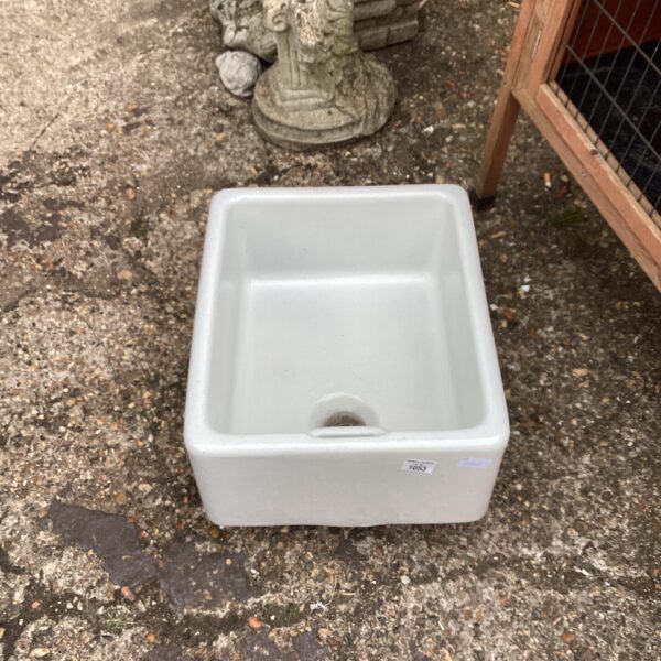 Vintage fireclay Belfast sink with a deep basin.