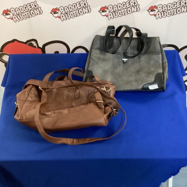 Pair of vintage brown leather handbags on a display surface.
