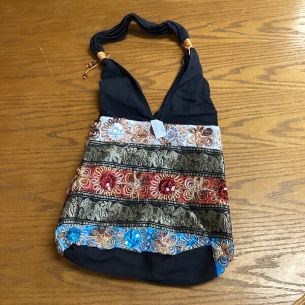 Colourful beaded shoulder bag with intricate embroidery.