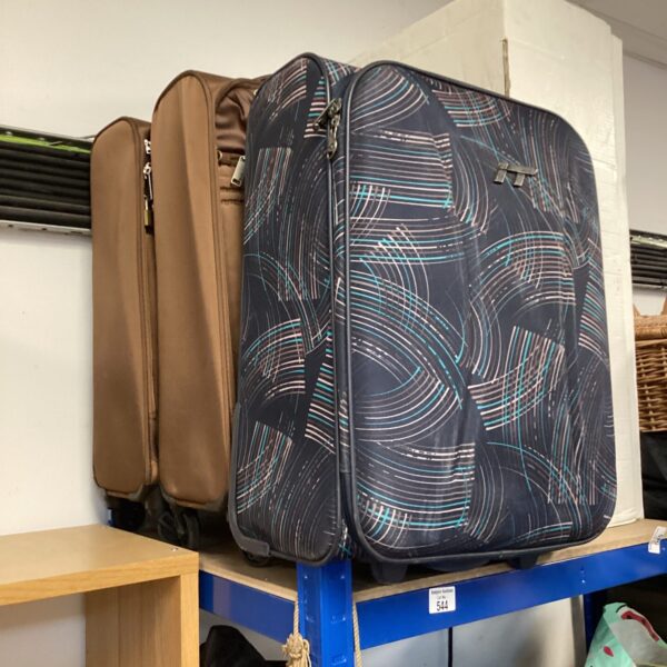 Blue and white patterned wheeled travel case for cabin travel.