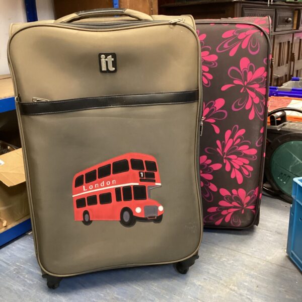 Large IT branded wheeled suitcase for travel.
