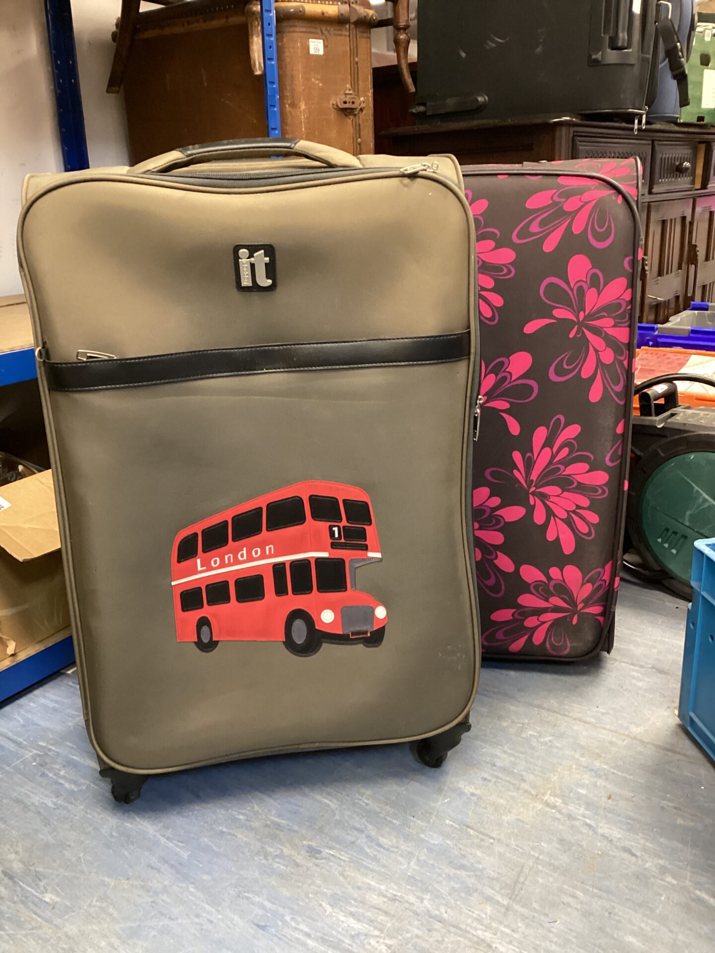 553 Two large wheeled suitcases inc trip & IT