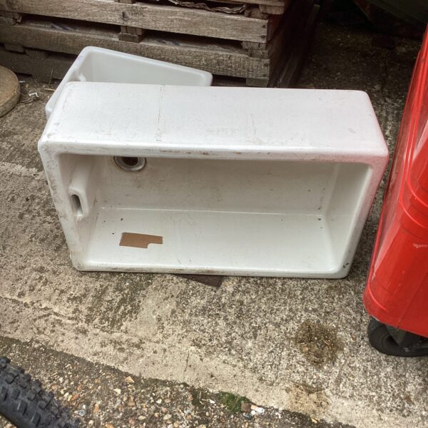 Large ceramic Belfast sink with a deep basin.