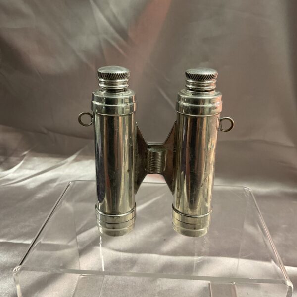 Vintage binocular hip flask, a unique collectible barware item.