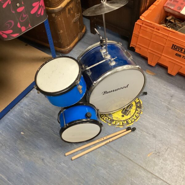 Bright blue miniature drum kit for children.