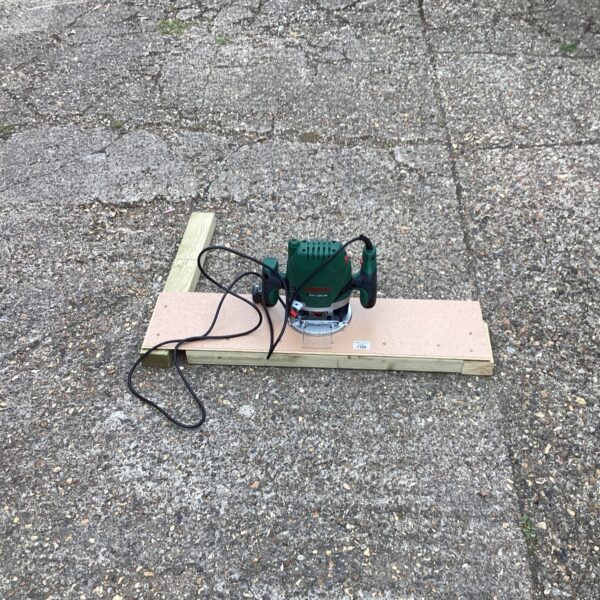 Bosch Rota router on wooden base, used power tool.