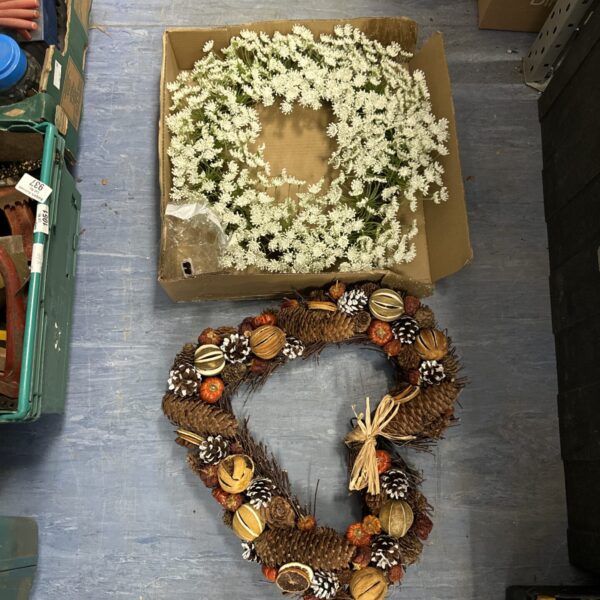 Pair of decorative wreaths with autumn and floral designs.