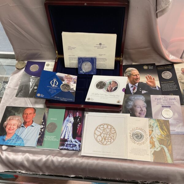 Royal commemorative coin collection in presentation folders.
