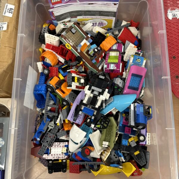 Assorted Lego Friends pieces with instruction booklets for building.