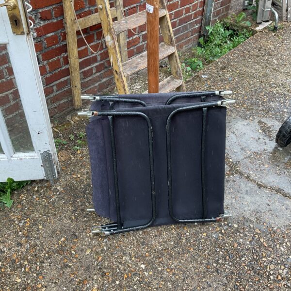 Pair of vintage sun loungers with metal frames.