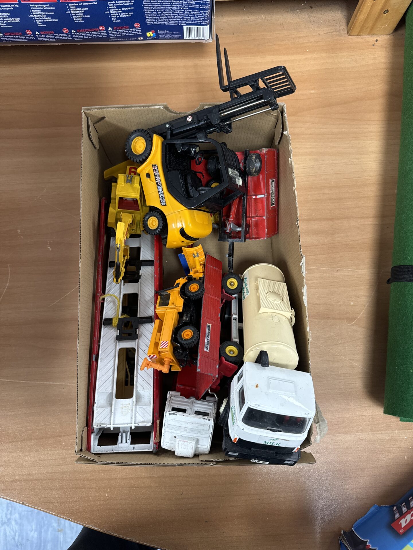 343 box of model trucks and a forklift