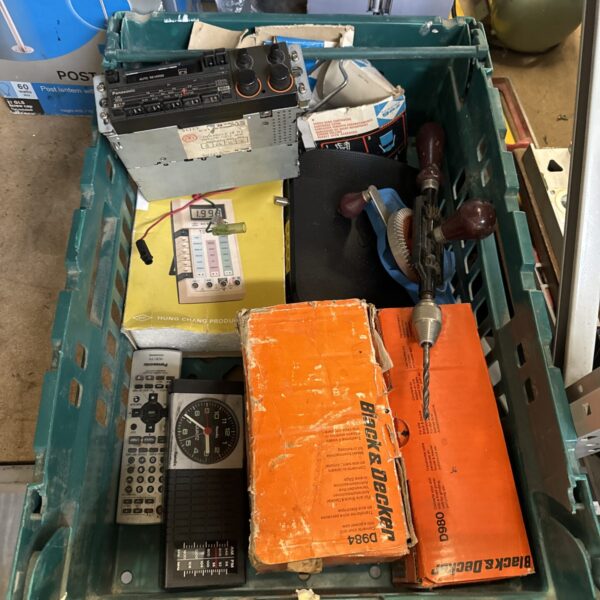 Mixed garage clearance lot with tools and electrical items.