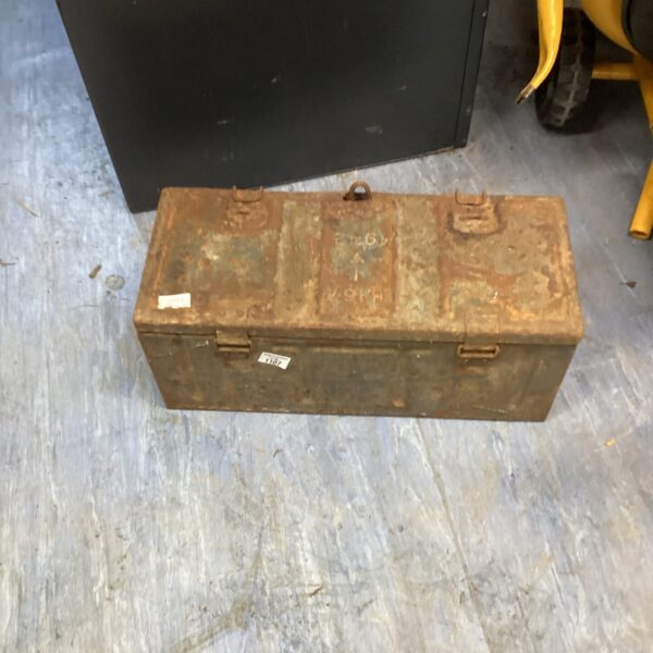 Weathered vintage metal tool box, ideal for workshop storage.