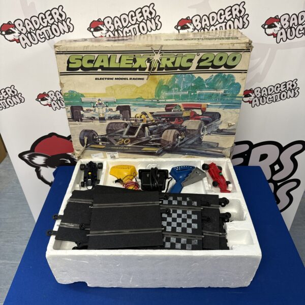 Vintage Scalextric 200 set with track sections.