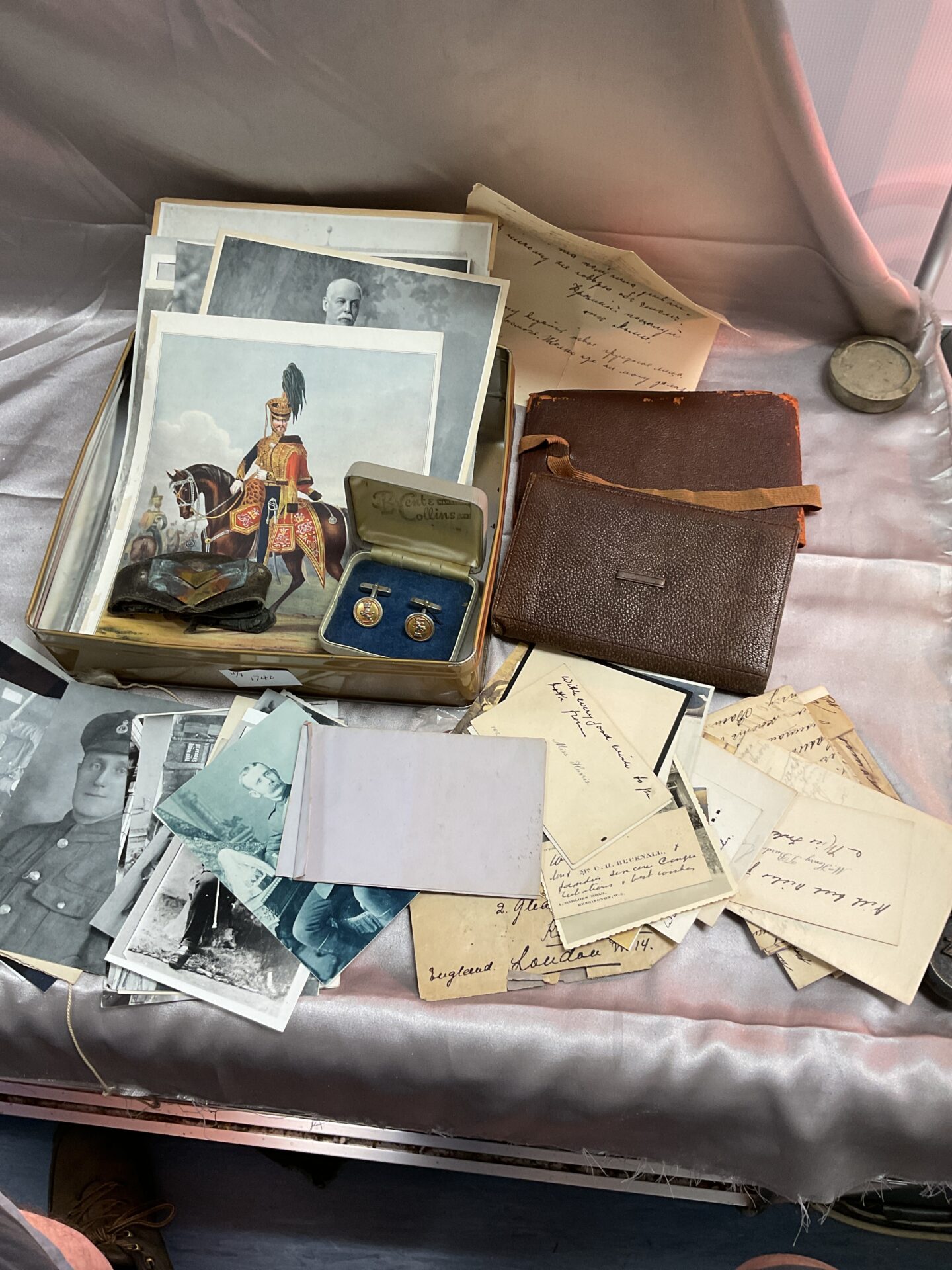 819 Tin mixed military related ephemera postcards wallets letters leather ect