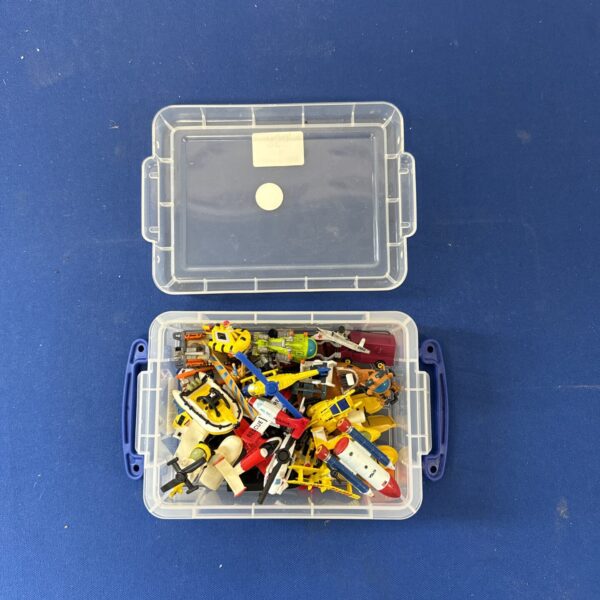 Micro Machines lot featuring a NASA rocket and miniature vehicles.