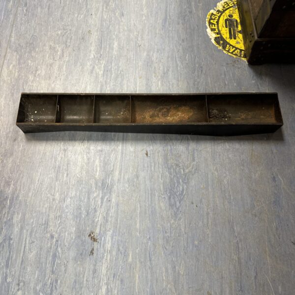 Rustic metal pet feeding trough, side view, vintage farmhouse style.