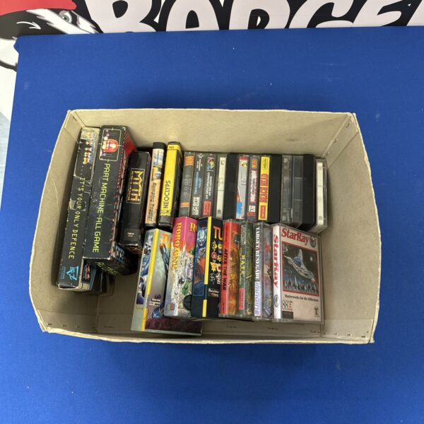 Vintage Commodore 64 cassette games lot including Turrican for retro gaming.