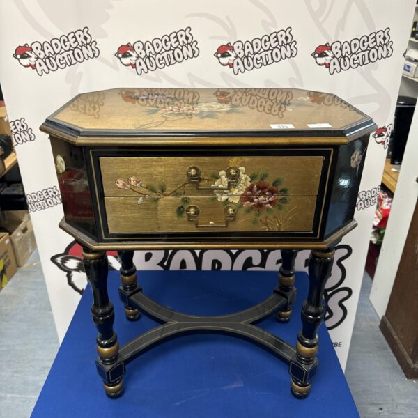 Antique oriental lacquered console table with floral details.
