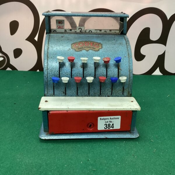 Front view of a vintage Codeg metal till.