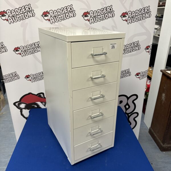 Vintage six-drawer metal file cabinet for office storage.