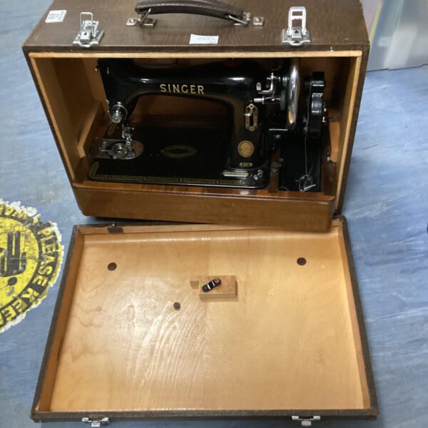 Vintage Singer sewing machine inside its original carrying case.