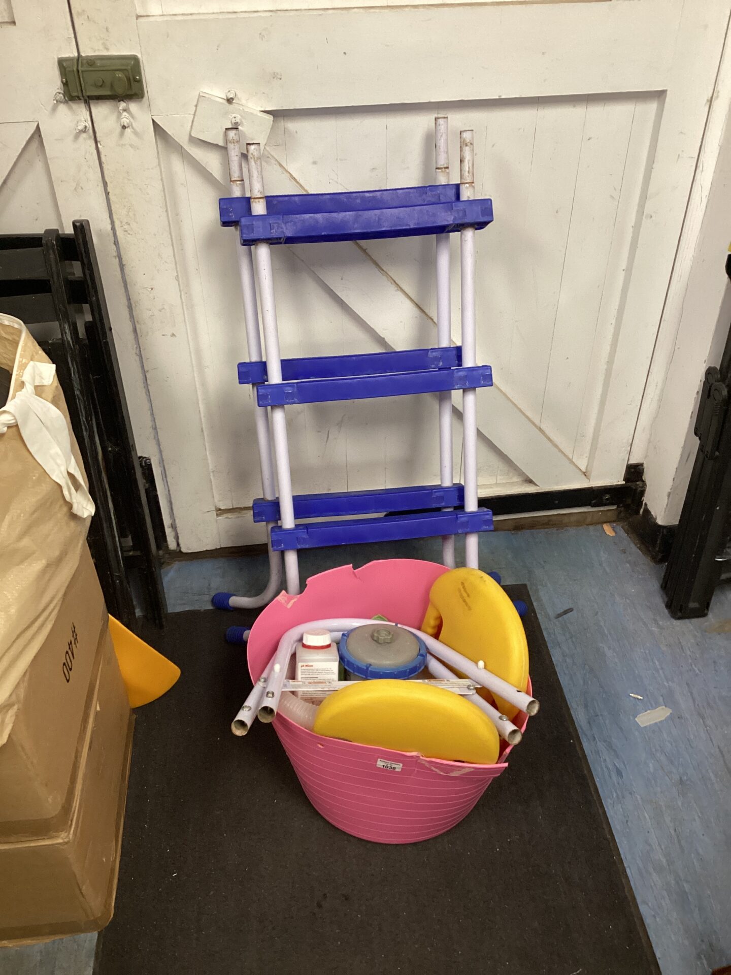 1038 Two pool ladders & pink tub of pool accessories inc pump & handrails