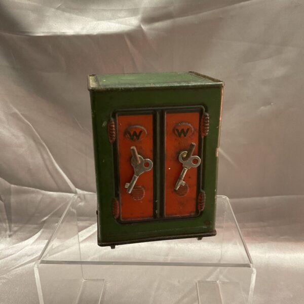 Front view of a vintage British tin money box.