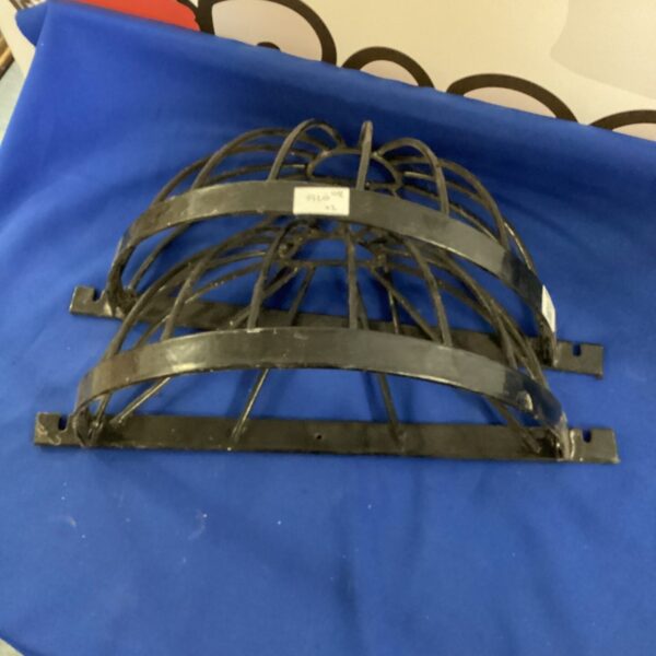 Vintage metal wall mounted flower baskets for garden display.