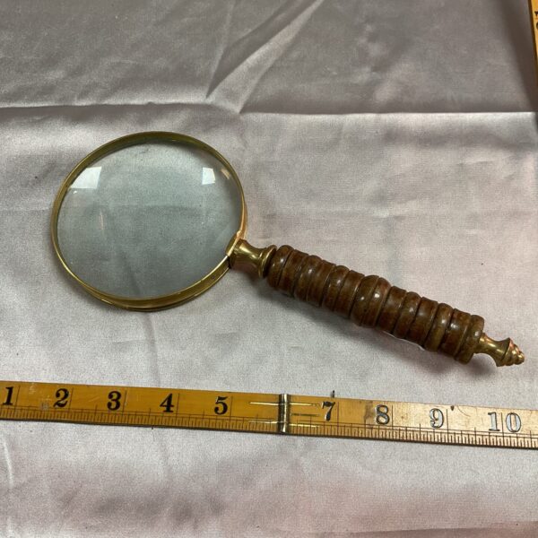 Antique brass and wood magnifying glass, Victorian era.