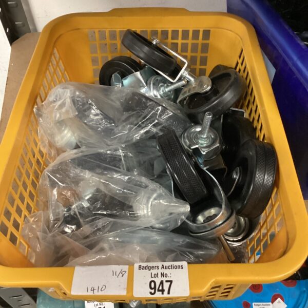 Assorted caster wheels in a plastic tub, useful for DIY projects.