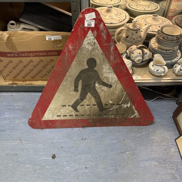 Vintage pedestrian crossing sign with red triangle and black silhouette.