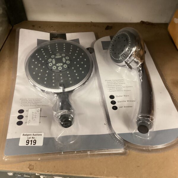 Pair of vintage chrome shower heads for bathroom restoration.