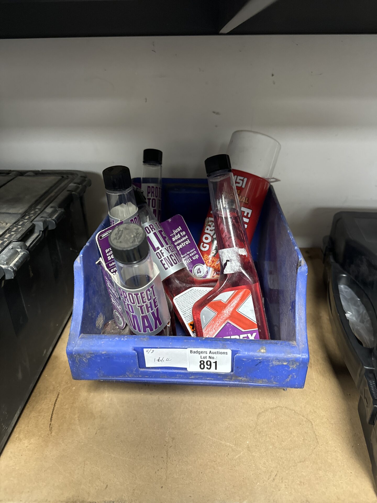 891 Six bottles of redex lead replacement fuel additive & a can of gorilla filler