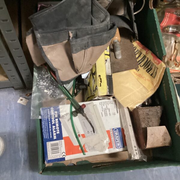 Mixed tool and hardware lot with chainsaw chain and tool belt.