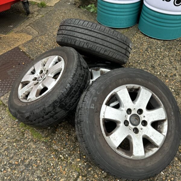 Set of four used VW Transporter alloy wheels with tyres.