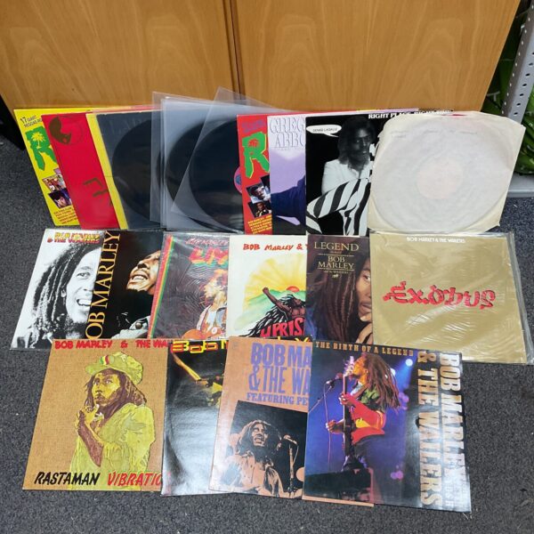 Collection of vintage Bob Marley and reggae vinyl records.