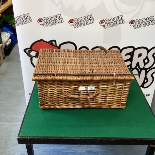 Vintage wicker basket with a classic woven pattern.
