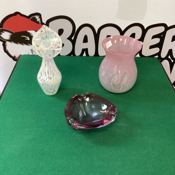Vibrant purple Murano glass vase with flowing form.