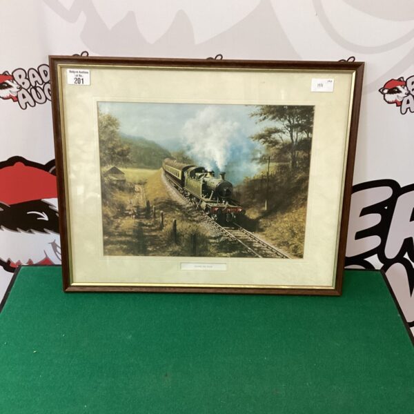 Vintage framed picture of a steam train titled "Racing The Train".
