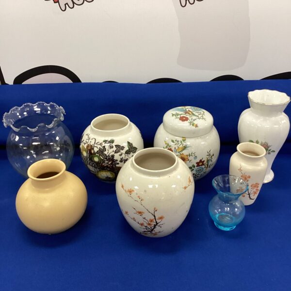 Vintage ceramic vases with floral patterns and intricate detailing.