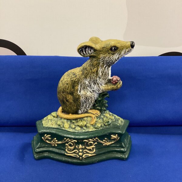 Detailed antique cast iron mouse doorstop for home decor.