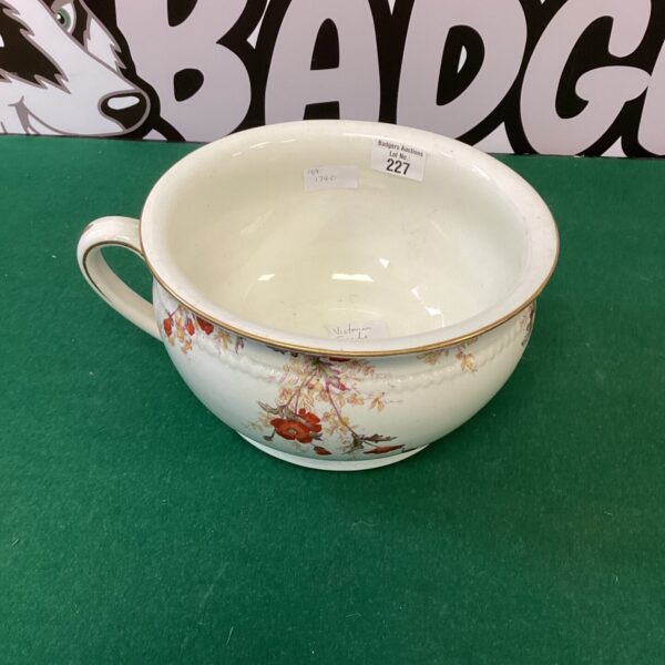 Antique Victorian Spode chamber pot with delicate floral design.