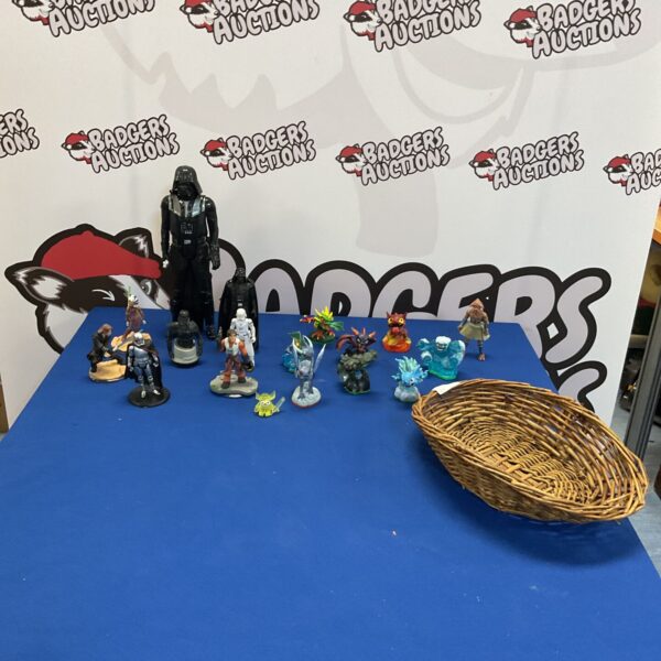 Basket of mixed collectible figures including Star Wars, Skylanders and Moshi Monsters.