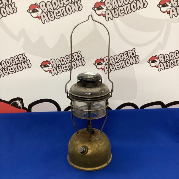 Brass vintage Tilley lamp with clear glass globe.