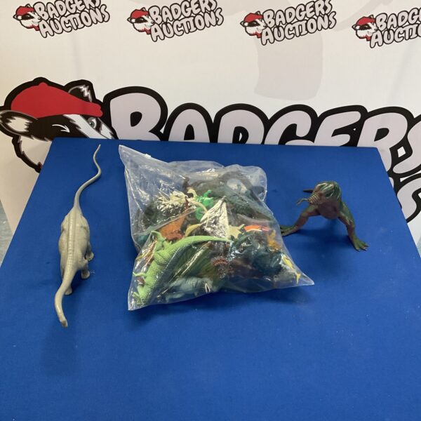 Collection of colourful plastic dinosaur figures for play.